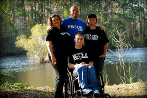 Family photo wearing 3E Love wheelchair heart, international symbol of acceptance