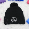 Black adult knit beanie hat w/ cuff and pom featuring our Circle of 3E Love embroidered with white threads