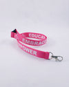 Pink Lanyards feature our International Symbol of Acceptance ("wheelchair heart symbol") and the three E's, Embrace, Educate and Empower.