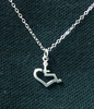 Small Pendant Necklace. The sterling silver pendant on this necklace is in the shape of our trademarked International Symbol of Acceptance (Wheelchair Heart). Item is individually handcrafted and will last forever.