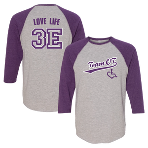 Vintage purple baseball tee. Our trademarked International Symbol of Acceptance ("wheelchair heart symbol") is featured proudly on your item